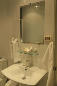 Ванна кімната в MONDIAL HOTEL