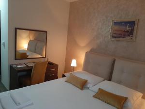 Postel nebo postele na pokoji v ubytování Hotel Usce