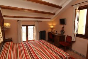 Posteľ alebo postele v izbe v ubytovaní Hotel Con Encanto La Façana