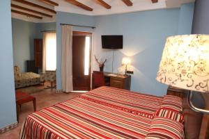 Posteľ alebo postele v izbe v ubytovaní Hotel Con Encanto La Façana