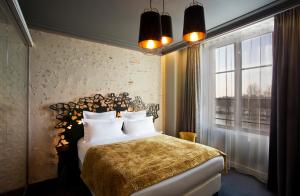 Ένα ή περισσότερα κρεβάτια σε δωμάτιο στο Empreinte Hotel & Spa