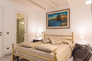 Postel nebo postele na pokoji v ubytování Carpe Diem B&B e Case Vacanza