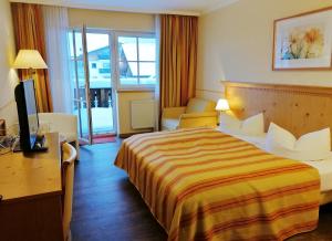 Postel nebo postele na pokoji v ubytování Hotel Sportalm