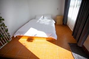 Postel nebo postele na pokoji v ubytování Giao Giao House Homestay