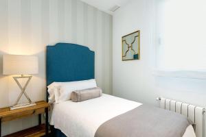 Postel nebo postele na pokoji v ubytování Genteel Home Mateos Gago