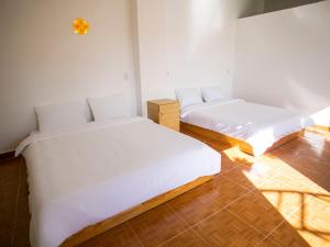 Postel nebo postele na pokoji v ubytování Giao Giao House Homestay