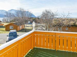 una cerca naranja en la parte superior de una casa en 6 person holiday home in Aukra, en Aukra