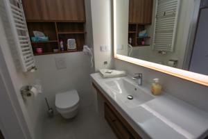 Kúpeľňa v ubytovaní Apartament z HUŚTAWKĄ Bel Mare