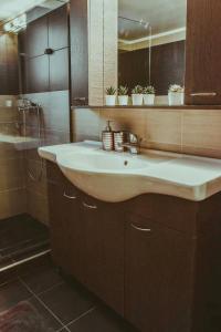 a bathroom with a sink and a shower at villa62rodos in Kremasti