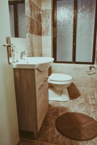 a bathroom with a sink and a toilet at villa62rodos in Kremasti +7 photos