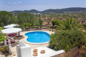 a villa with a pool and a view at Pau de Baix in San Antonio