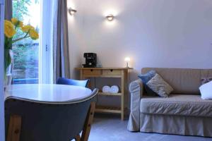 a living room with a couch and a table at Arnhem Studios in Arnhem