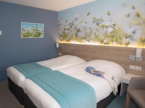 Cama ou camas em um quarto em Mercure Trouville Sur Mer