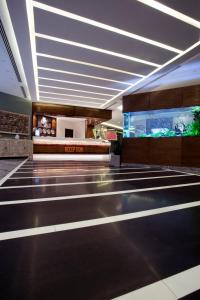 a lobby of a hotel with a fish tank at La Casa Hotel Amman by FHM in Amman