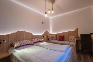 Postel nebo postele na pokoji v ubytování Hotel Pezzotti