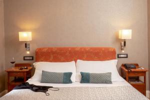 Cama ou camas em um quarto em Hotel Alexandra
