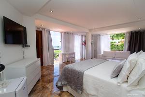 Postel nebo postele na pokoji v ubytování Charme Pousada Boutique & Spa