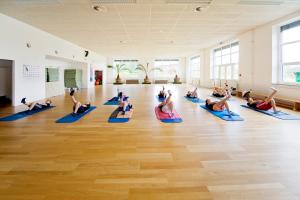 a group of people doing yoga in a room at Sportpark Rabenberg in Breitenbrunn +36 photos
