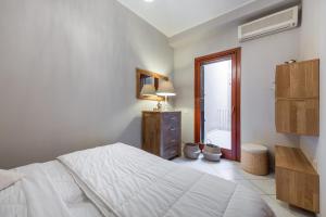 Letto o letti in una camera di Suite Home Simius