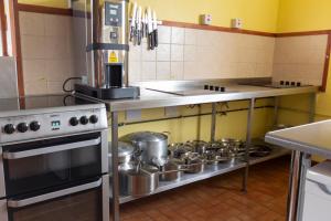 a kitchen with a bunch of pots and pans at Durness Youth Hostel in Durness