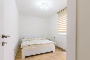 Cama o camas de una habitación en Apartmani “LAZAR” i “LENA”