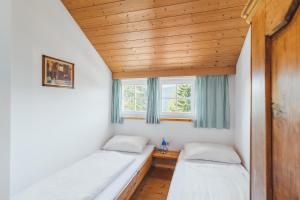 Postelja oz. postelje v sobi nastanitve Alpine Cabin