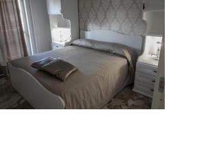 a bed with a pillow on it in a bedroom at B&B ARENA in Pompei