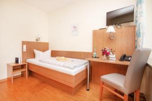 Postel nebo postele na pokoji v ubytování Das Gästehaus Puschendorf