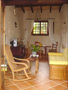 a living room with a couch and a table at Agroturisme Son Torrat in Petra