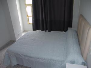 A bed or beds in a room at TABLERO 302, MAGNIFICO Apto 6 pax cerca PLAYA INGLES