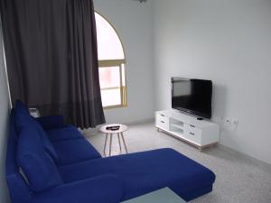 A television and/or entertainment centre at TABLERO 302, MAGNIFICO Apto 6 pax cerca PLAYA INGLES