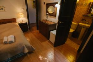 A bed or beds in a room at Eudora Full Guest House