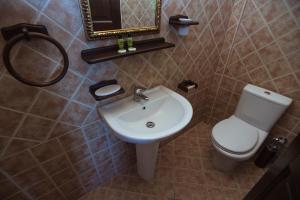A bathroom at Eudora Full Guest House