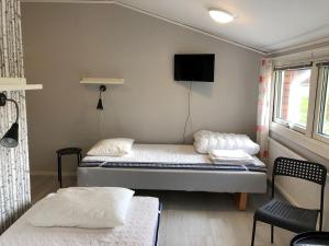 Postel nebo postele na pokoji v ubytování STF Malmfältens Folkhögskola