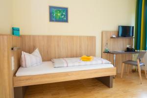 Postel nebo postele na pokoji v ubytování Das Gästehaus Puschendorf
