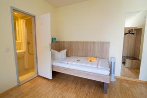 Postel nebo postele na pokoji v ubytování Das Gästehaus Puschendorf
