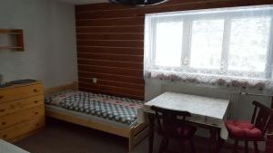 Postel nebo postele na pokoji v ubytování Chalupa 387
