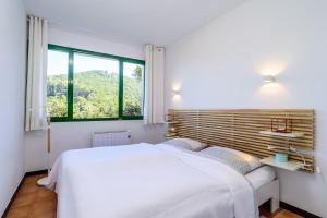 Posteľ alebo postele v izbe v ubytovaní SR-32 BEGUR SA RIERA 4 PAX