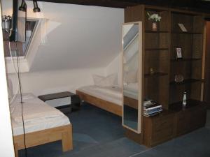 Säng eller sängar i ett rum på Gasthaus Löwen