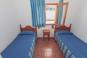 Postel nebo postele na pokoji v ubytování Montecarlo Apartamento8