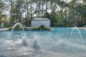 a pool with water fountains in a yard at Sandestin Golf and Beach Resort in Destin
