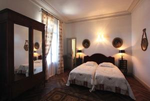 Un pat sau paturi într-o cameră la Les Buis