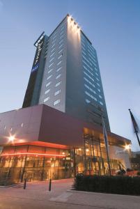 a tall building with lights on top of it at Radisson Blu Hotel, Hasselt in Hasselt