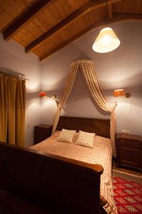 A bed or beds in a room at Amadryades Boutique Hotel