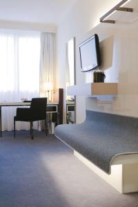 TV a/nebo společenská místnost v ubytování Radisson Blu Waterfront Hotel, Jersey