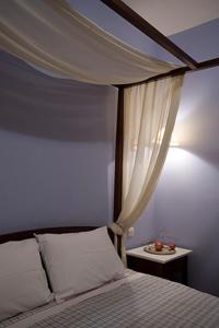 Łóżko lub łóżka w pokoju w obiekcie Amadryades Boutique Hotel