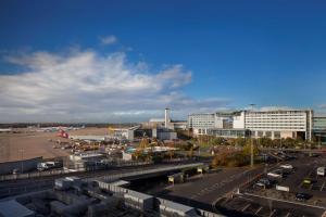 a view of an airport with a parking lot at Radisson Blu Manchester Airport in Hale