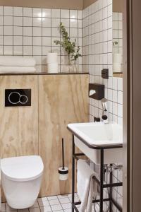 a bathroom with a toilet and a sink at Radisson Blu Seaside Hotel, Helsinki in Helsinki