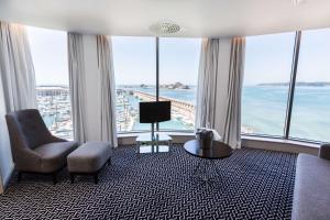 a living room with a view of the ocean at Radisson Blu Waterfront Hotel, Jersey in Saint Helier Jersey