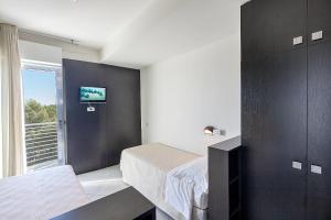 Postel nebo postele na pokoji v ubytování Hotel Lido